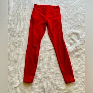 Athleta red 7/8 leggings with side pocket zippers